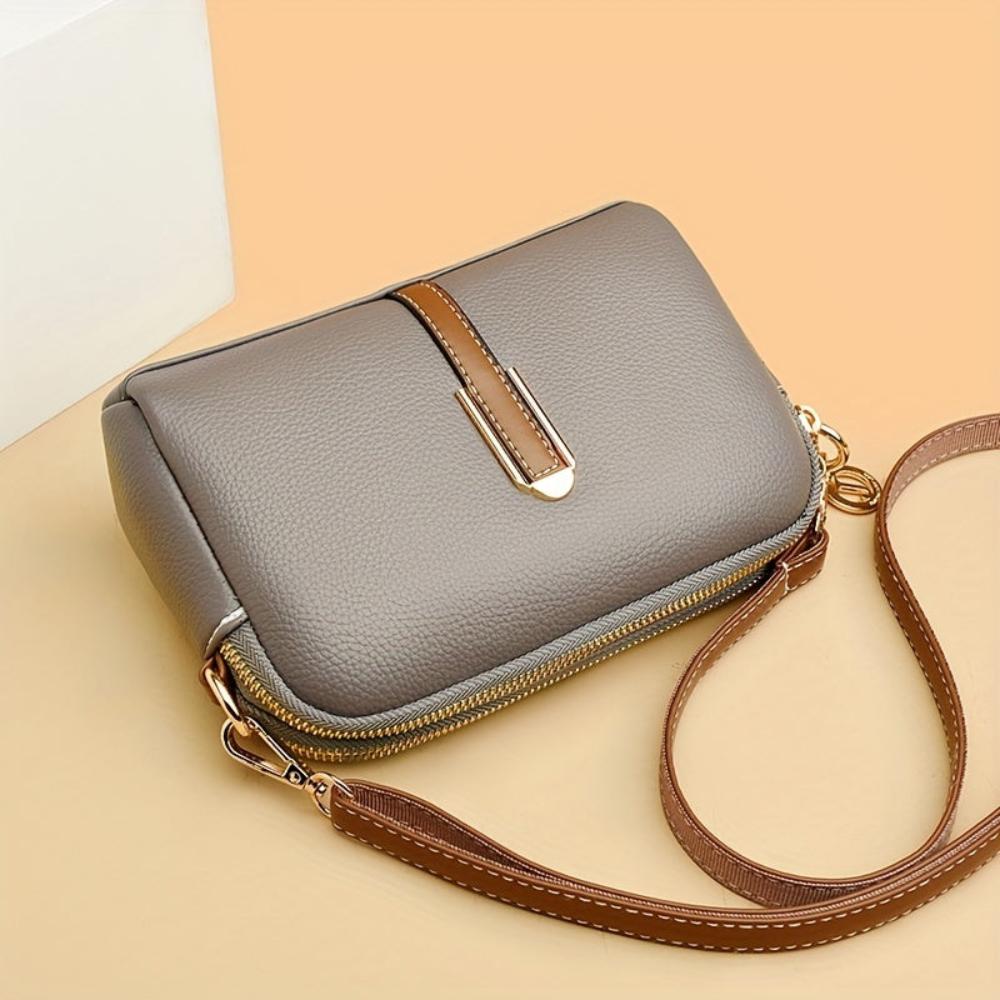 Mila | Sac à bandoulière avec texture lychee